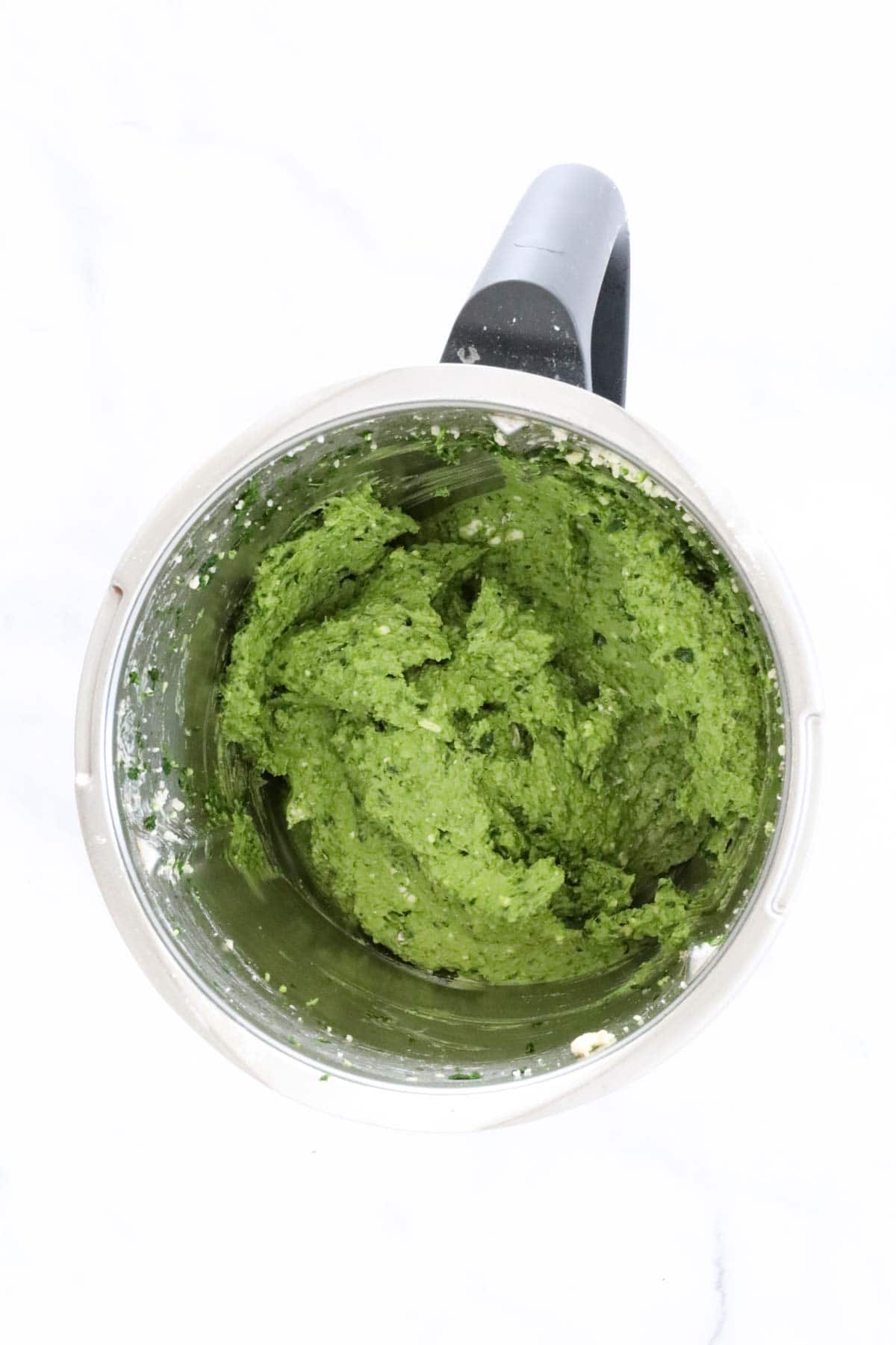 Green spinach mixture in a Thermomix.