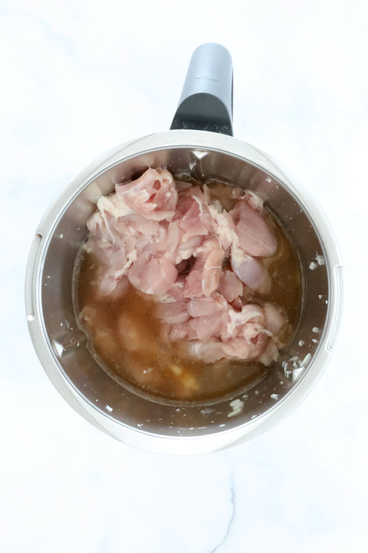 Chopped chicken in a Thermomix.