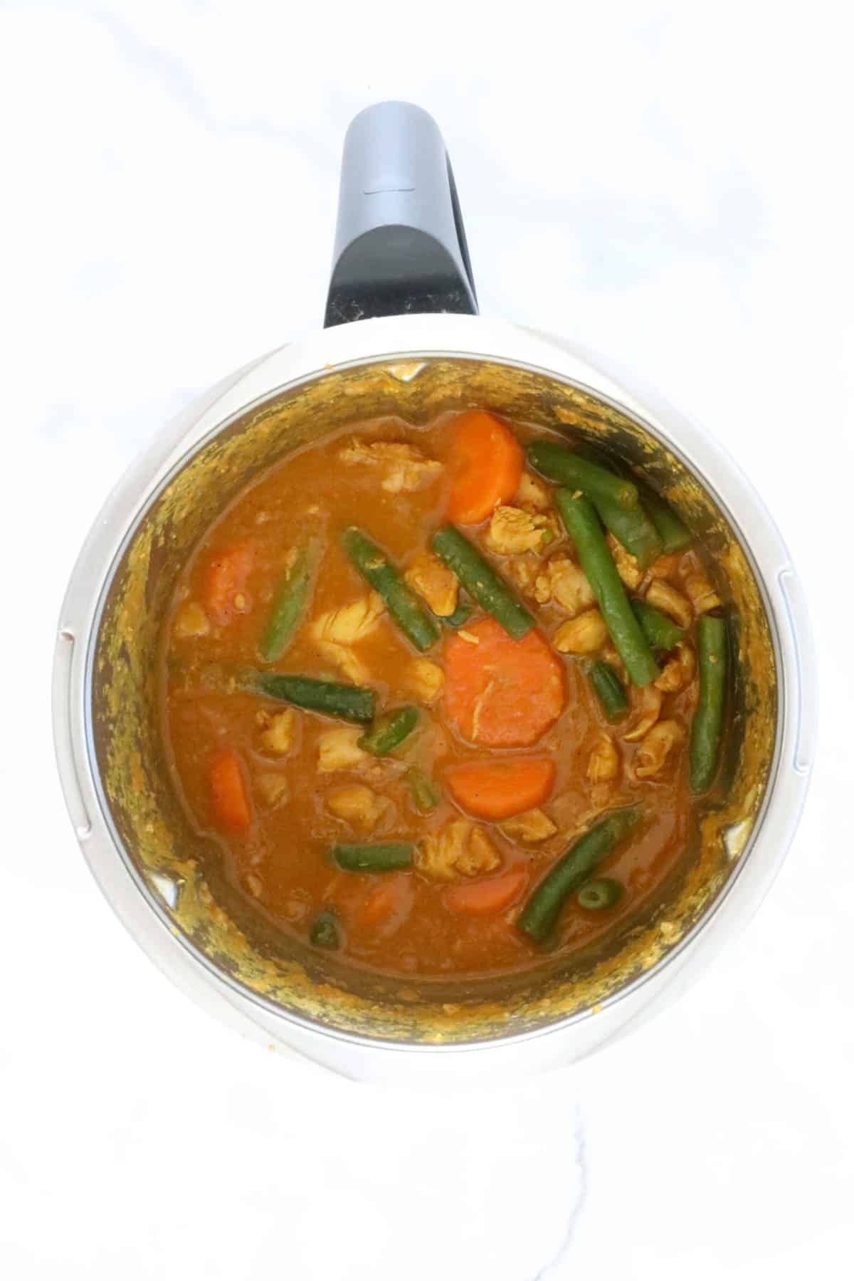 Chicken and vegetables in a curry sauce in a Thermomix.