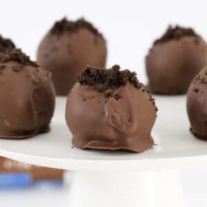 Oreo crumbs on top of chocolate truffles.