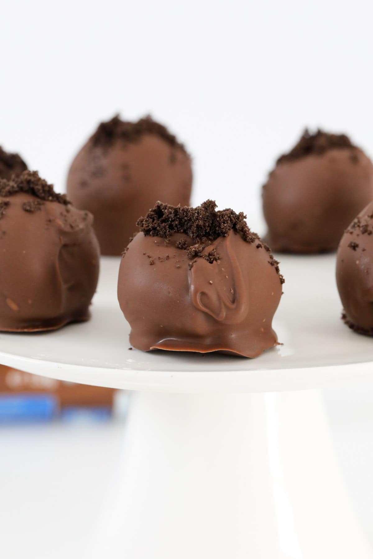 Oreo crumbs on top of chocolate truffles.