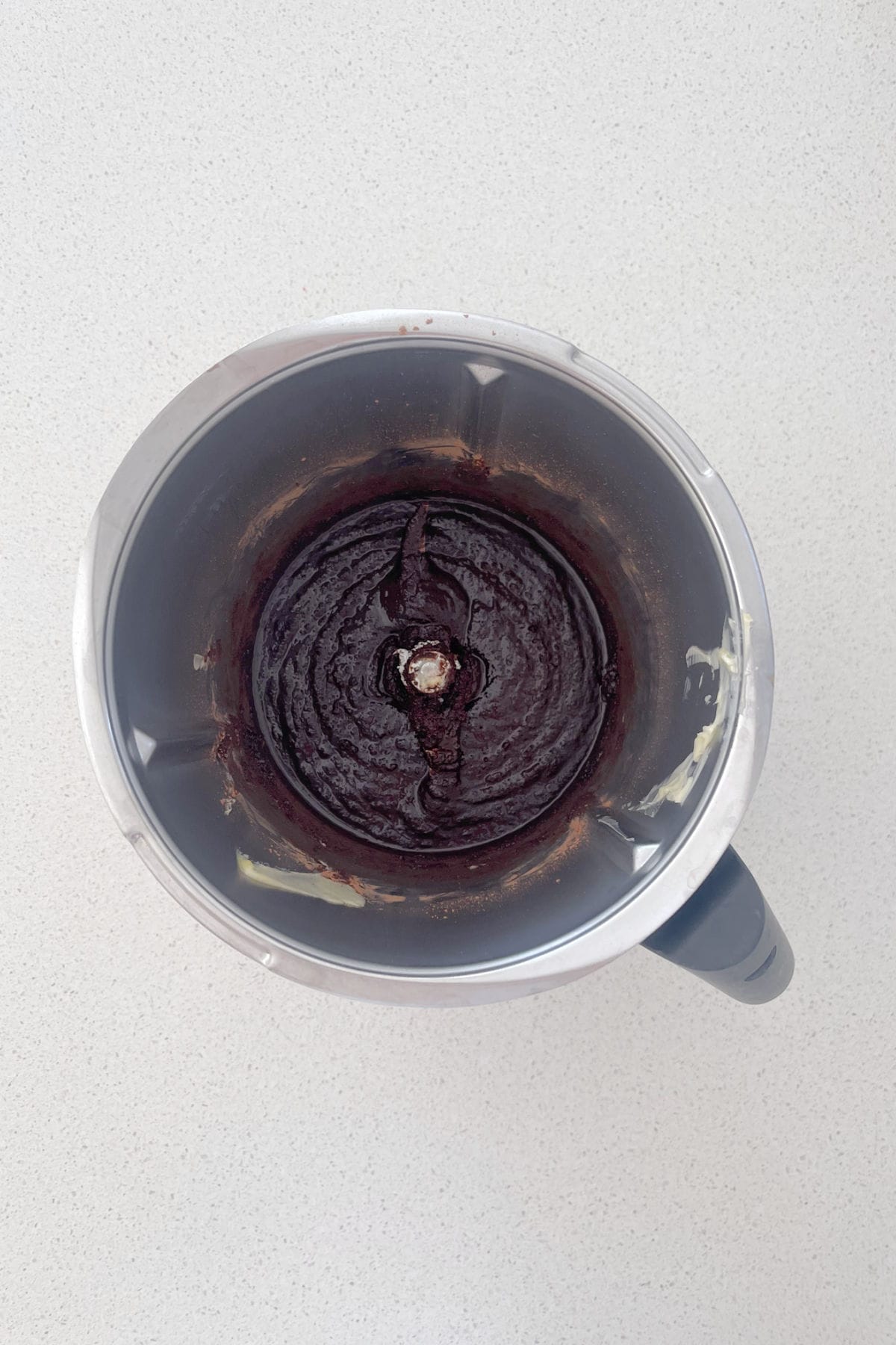 Melted butter, cocoa and sugar in a thermomix bowl.
