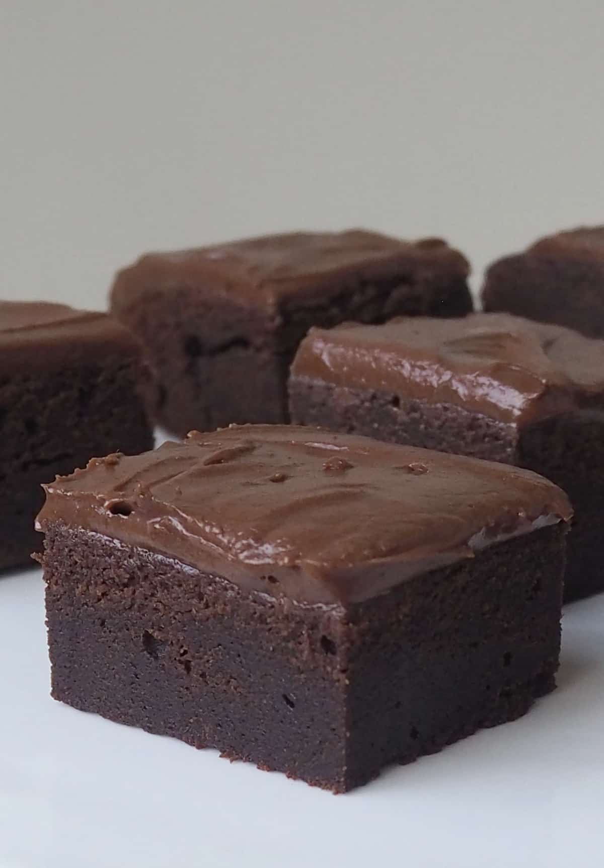 Side view of 5 Brownie on a white plate.