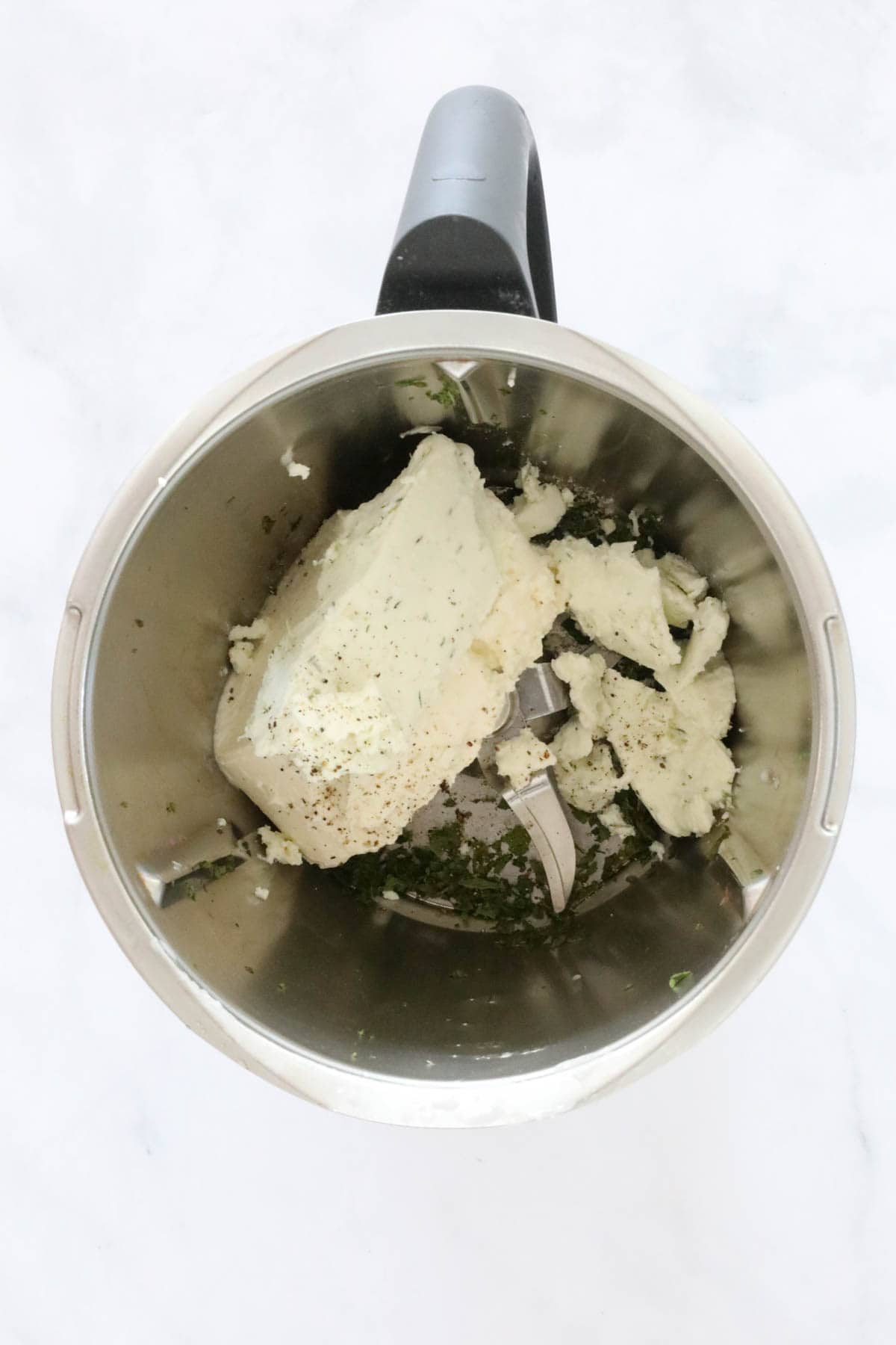 Cheese and herbs in a Thermomix.