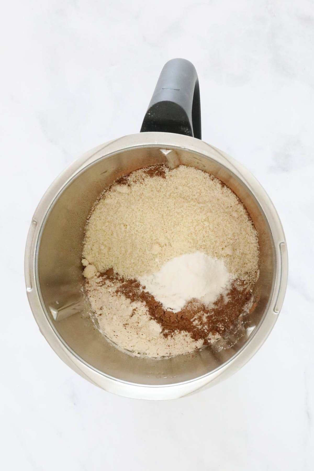 Dry ingredients in a Thermomix bowl.