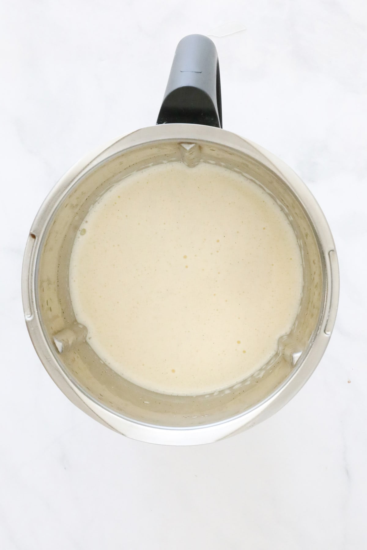 Creamy vanilla bean liquid in a Thermomix.