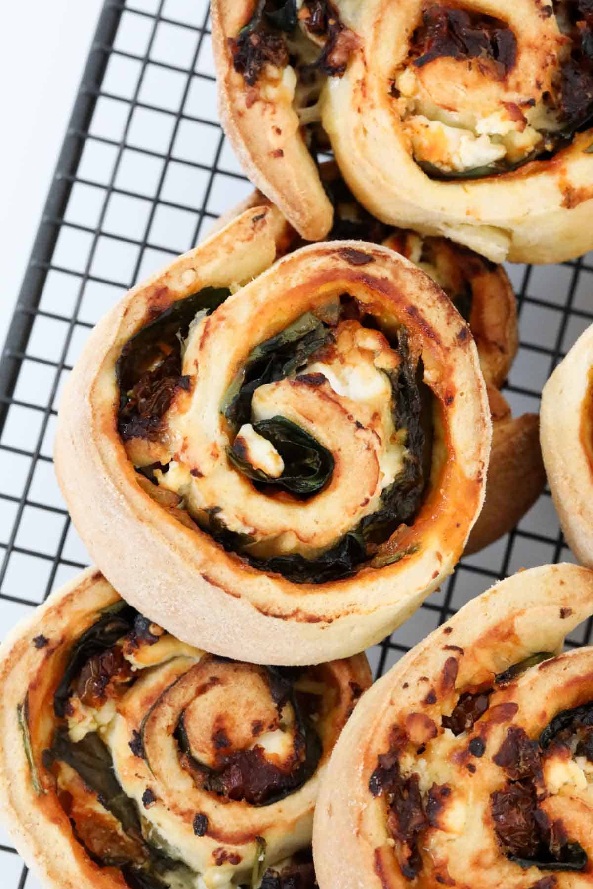 n overhead shot of spinach and cheese scrolls.