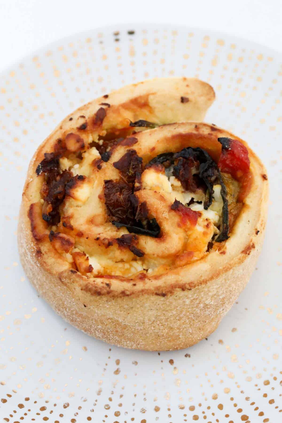 An overhead shot of a savoury baked scroll.