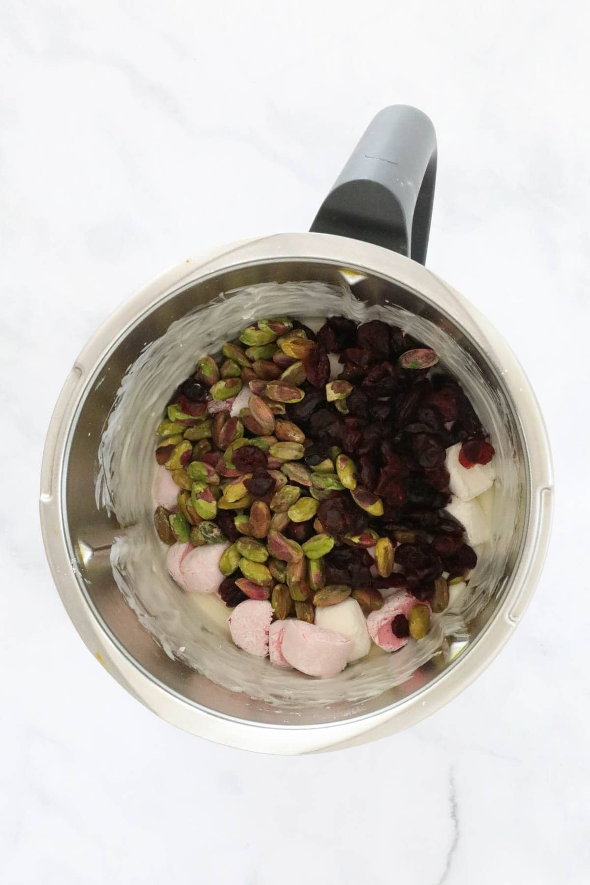 Marshmallows, pistachios and dried cranberries in a Thermomix.