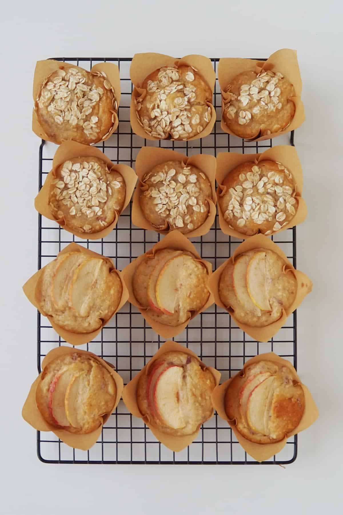 Apple Muffins sitting on a black cooling rack.