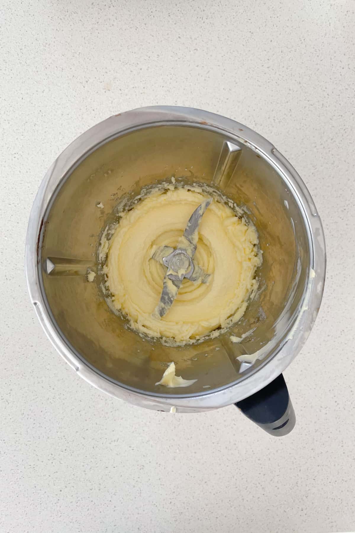 butter and sugar mixed together in a thermomix bowl.