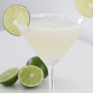 A martini glass filled with margarita.