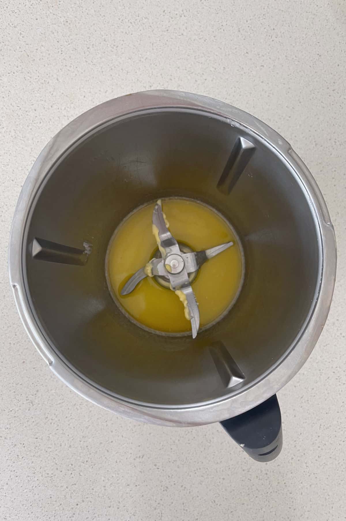 Melted butter in a Thermomix bowl.