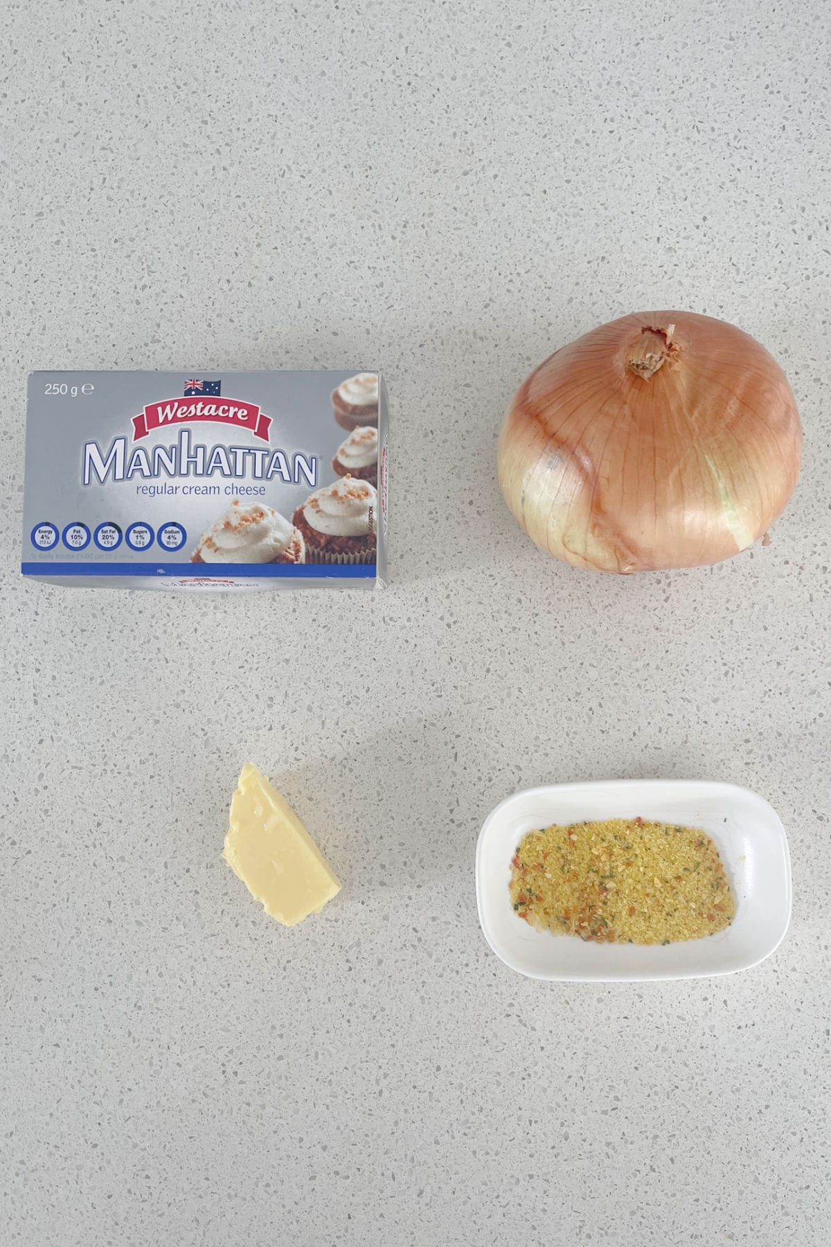 Ingredients to make French Onion Dip in a Thermomix on a speckled bench.