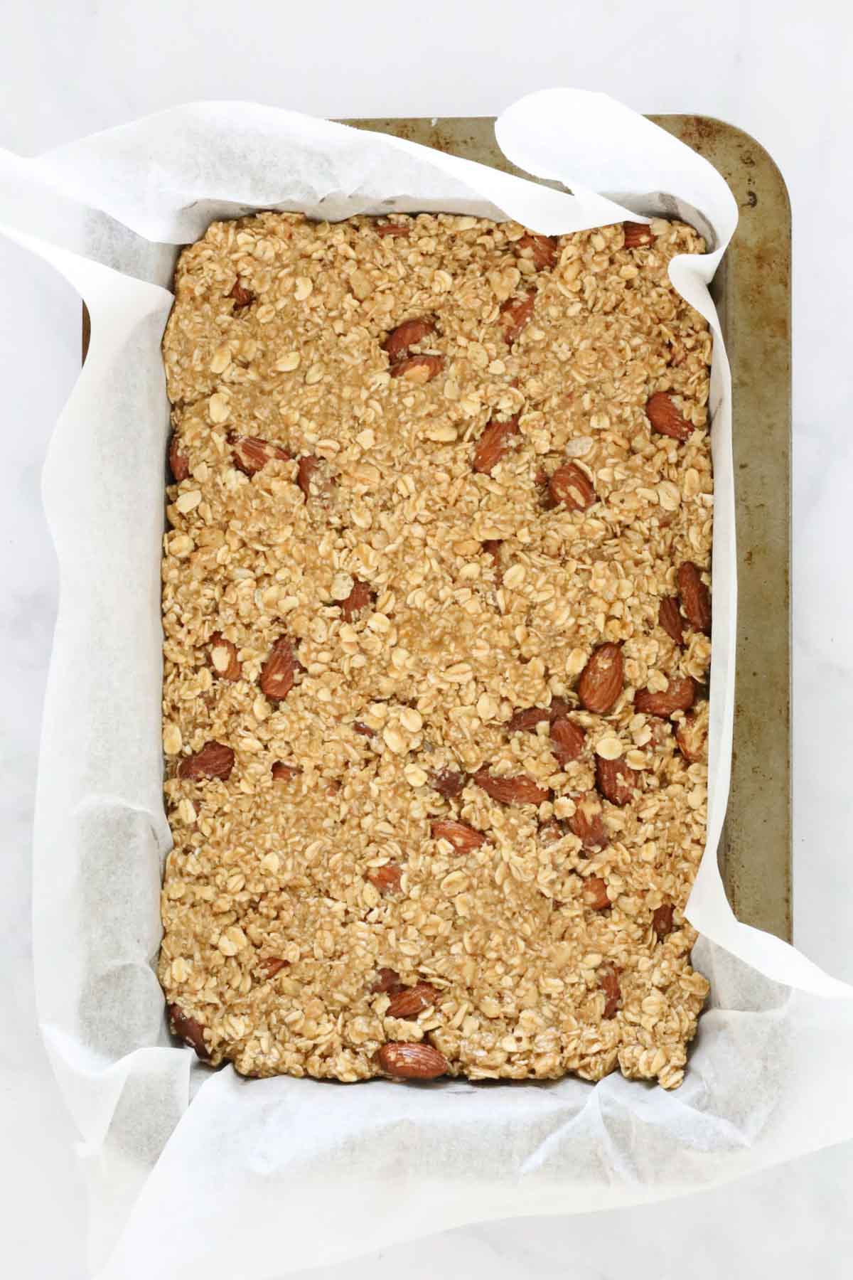 A baking tray with muesli nut slice.
