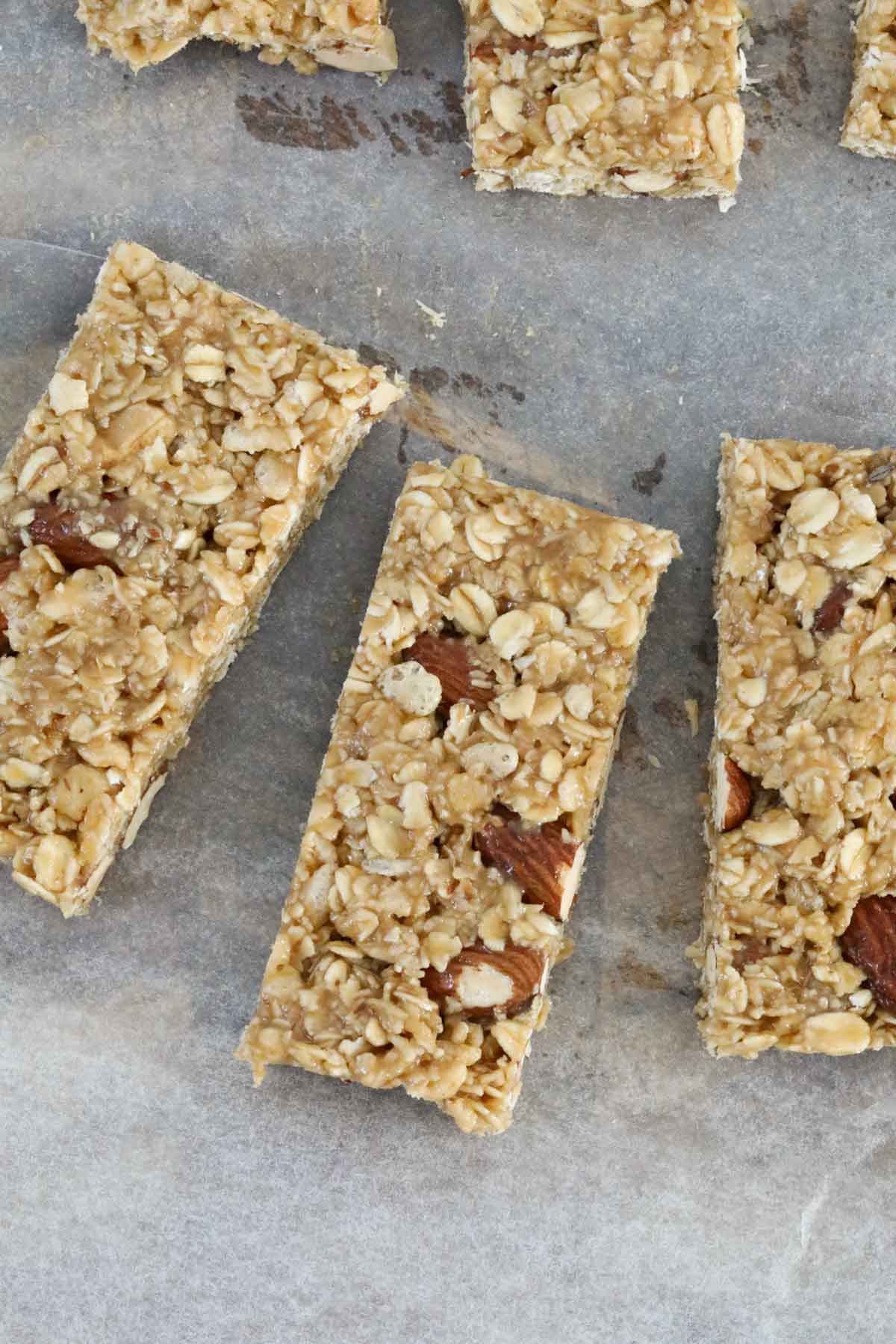 Pieces of muesli slice on a chopping board.