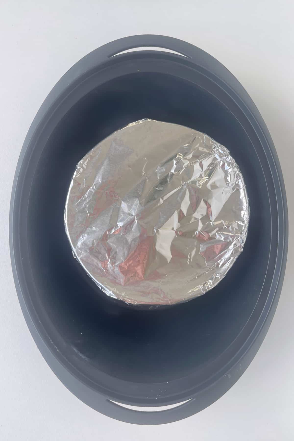 Pudding dish covered with baking paper and foil in a Varoma.