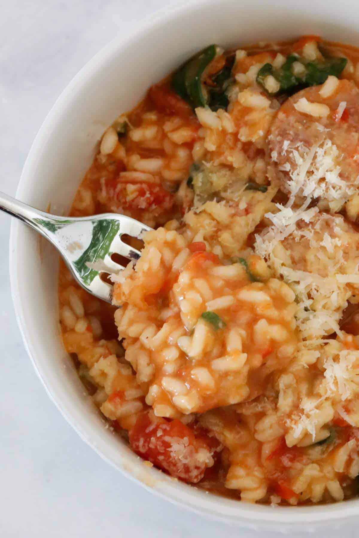 A forkful of tomato risotto.
