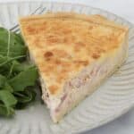 A slice of egg and bacon quiche.