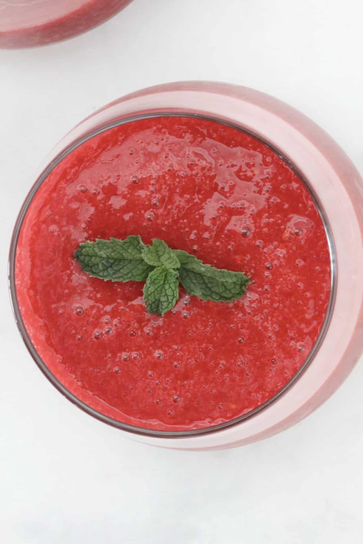 An overhead shot of a raspberry drink.