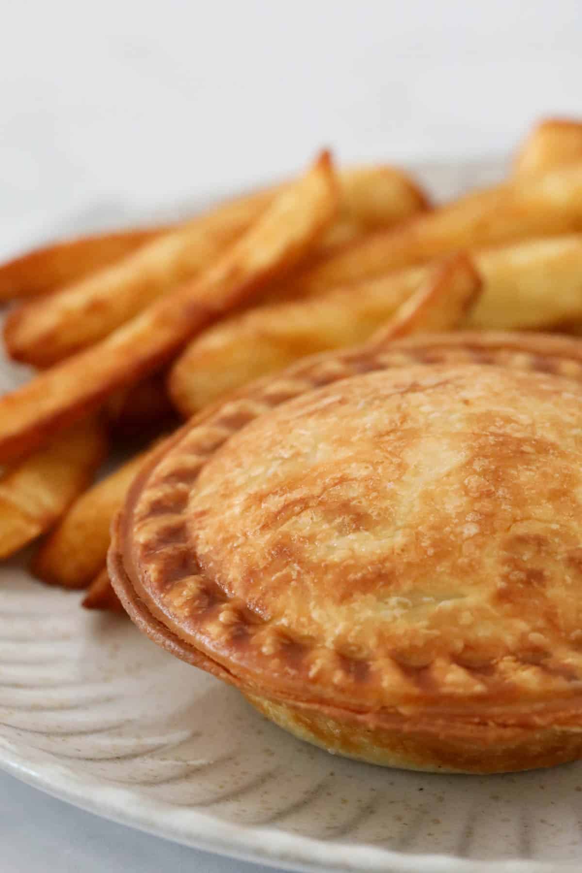 A flaky pie with chips.