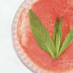 An overhead shot of a watermelon and mint drink.