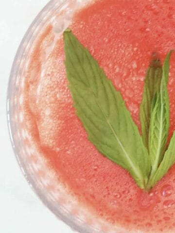 An overhead shot of a watermelon and mint drink.