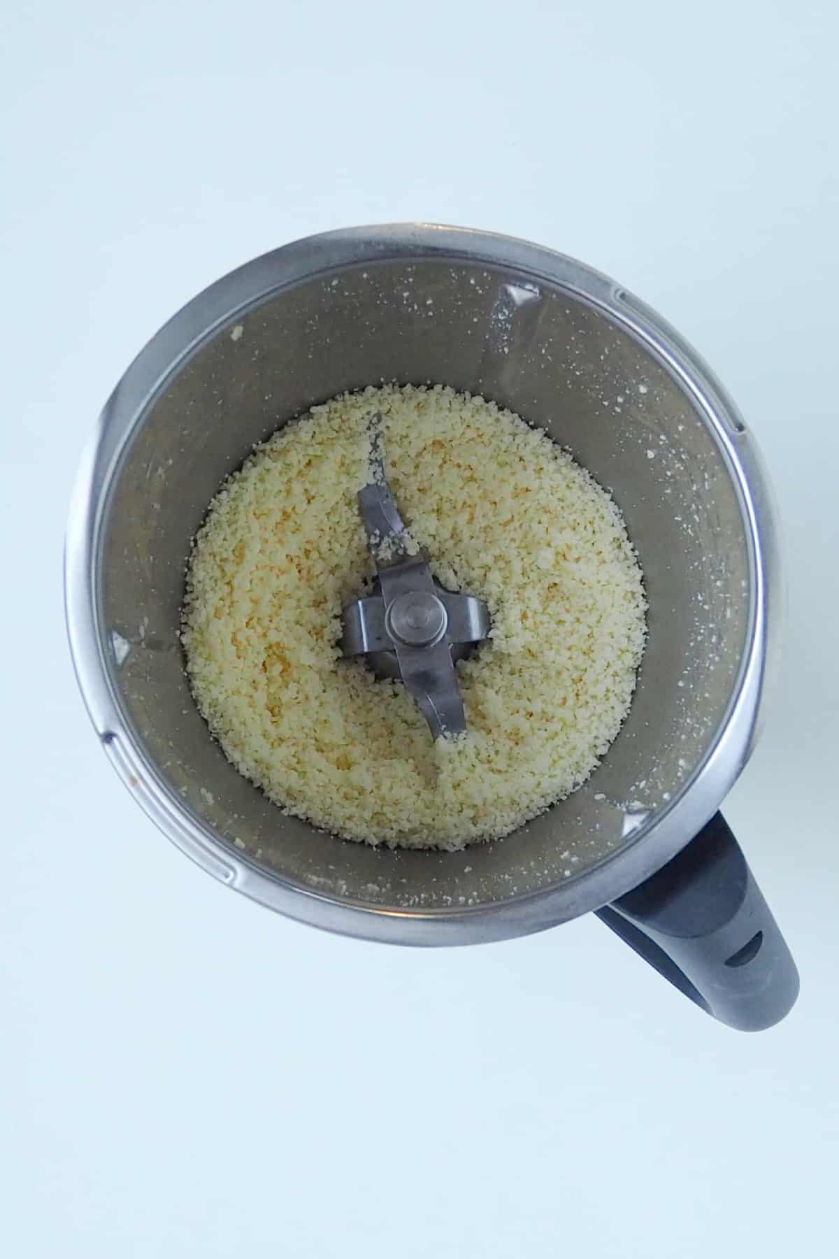 Grated cheese in a thermomix bowl.