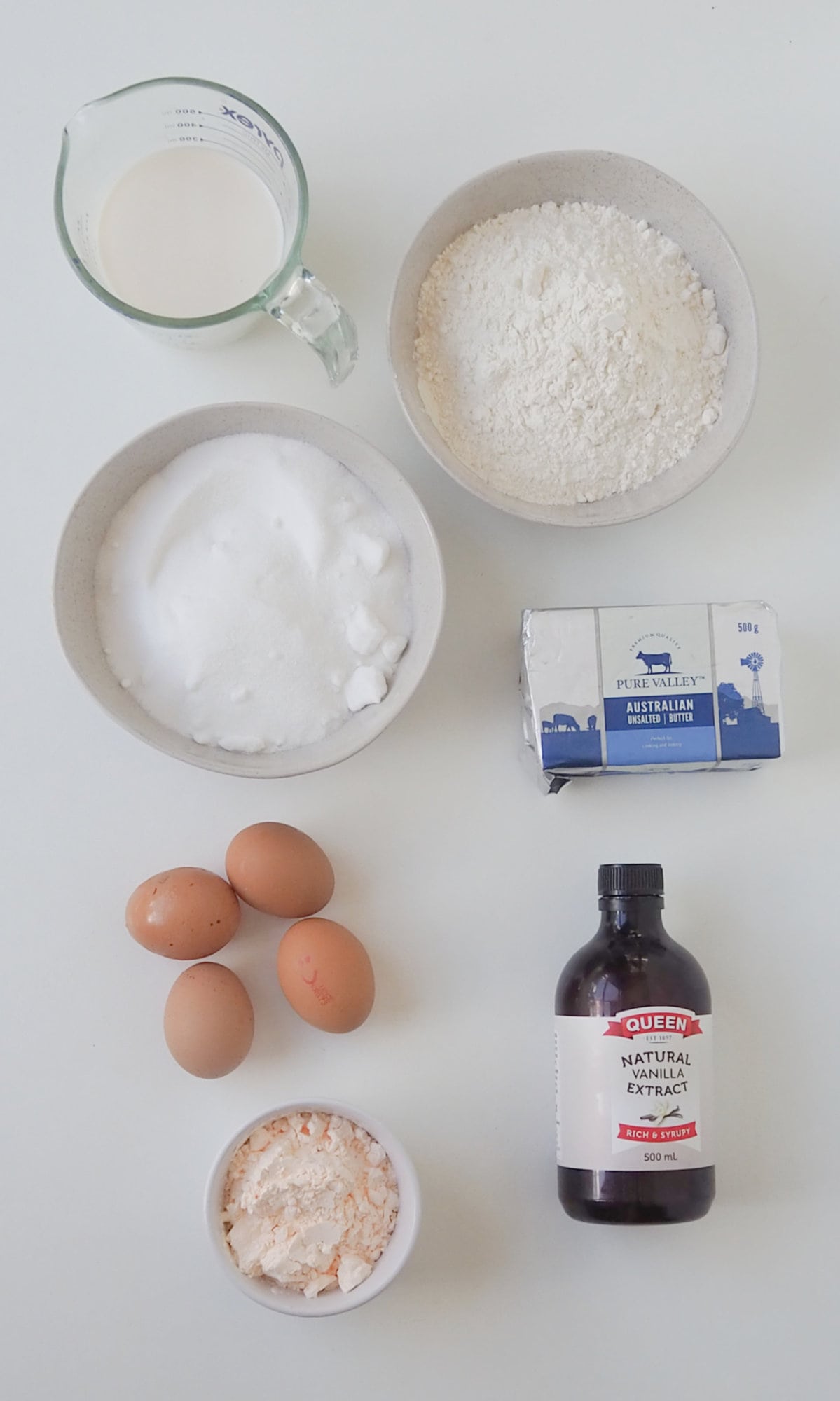 Ingredients to make a Custard Cake in a Thermomix on a white background.