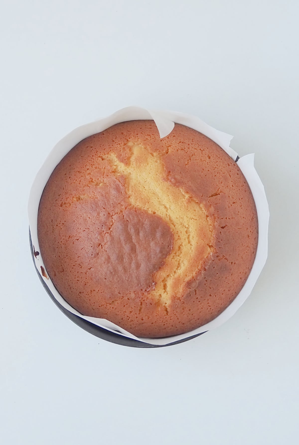 Overhead view of a custard cake straight from the oven.