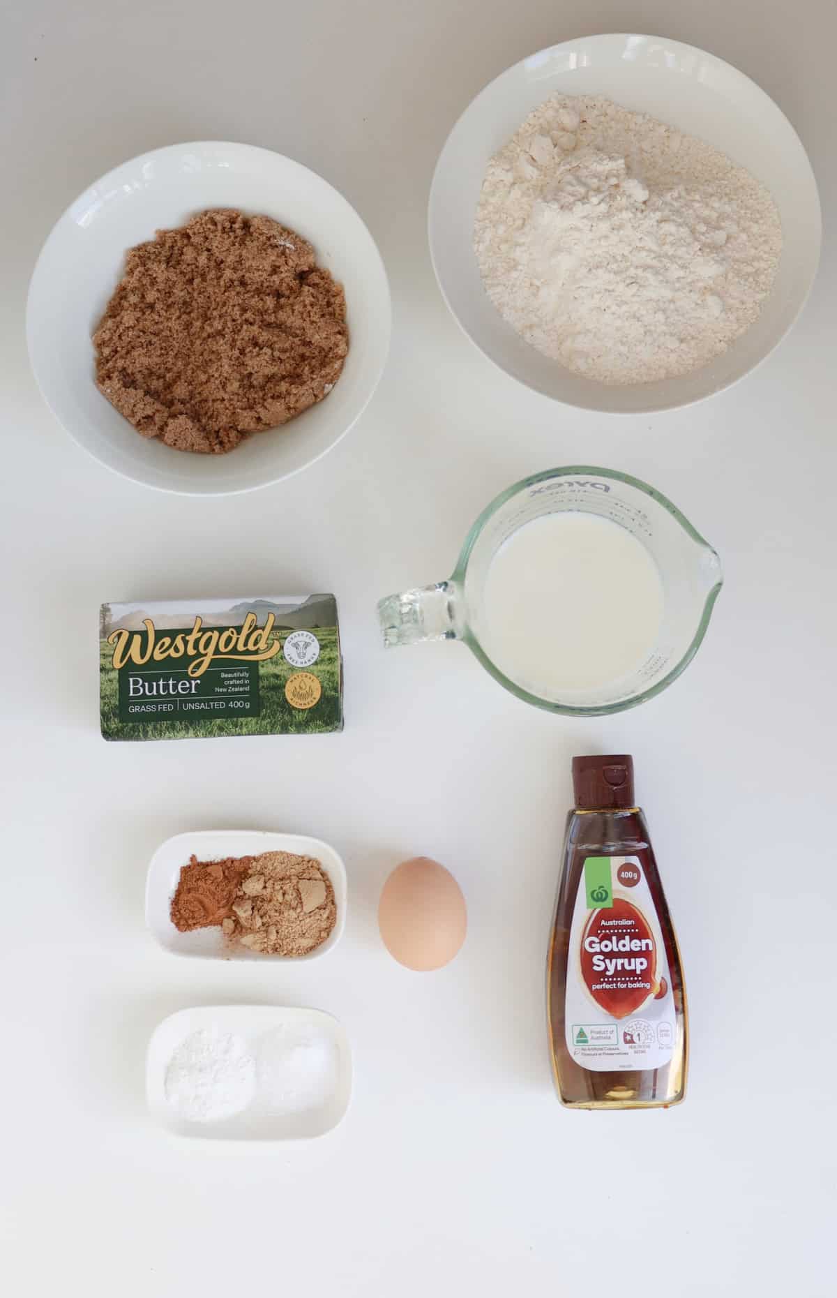 Ingredients to make a Gingerbread Loaf in a Thermomix on a white background.