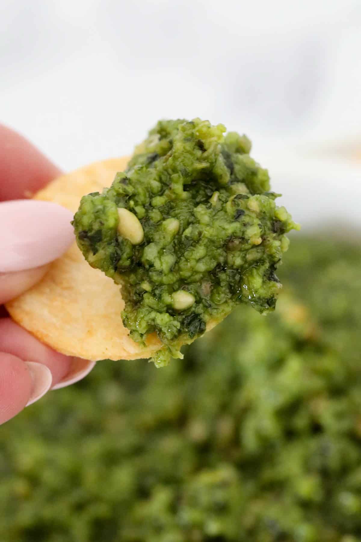 Basil pesto on a cracker.