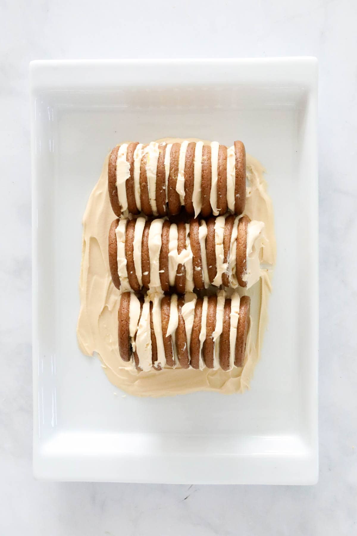 An overhead shot of whipped cream and biscuits.