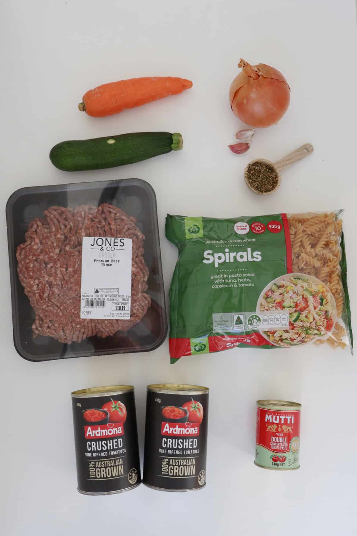 Ingredients to make a pasta bake in the thermomix on a white bench.