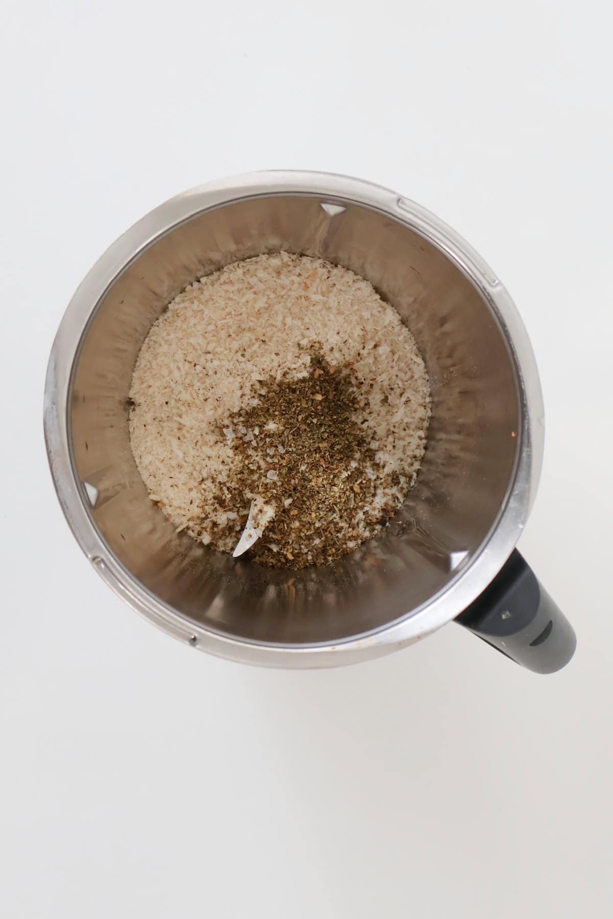 Chicken tenders coating in a thermomix bowl.