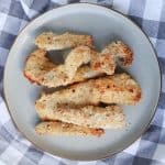 Overhead view of a plate of chicken tenders.