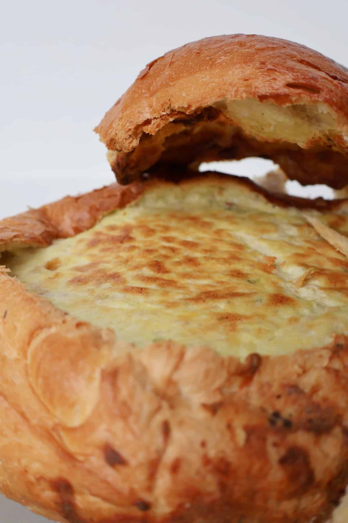 Cooked Bacon and Cheese Cob Loaf on a baking tray.