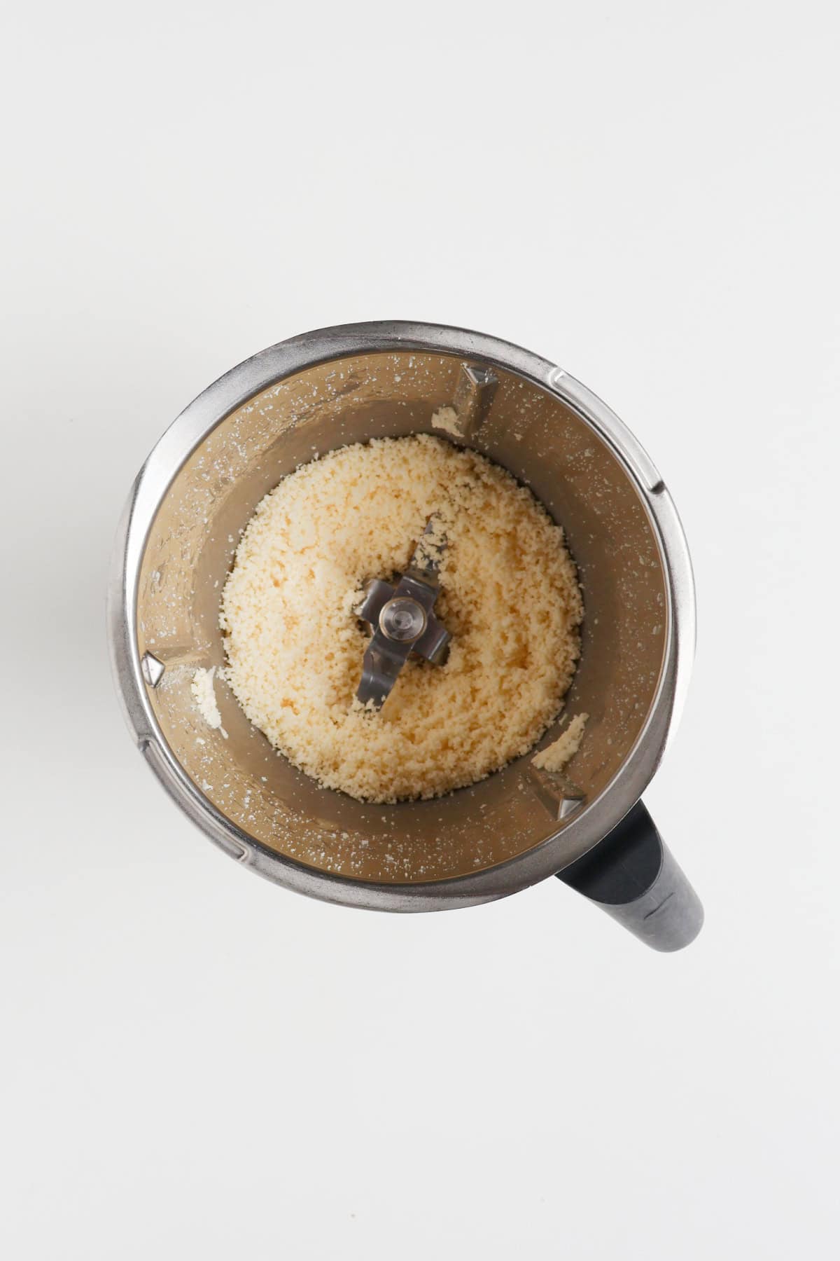 Grated cheese in a thermomix bowl.