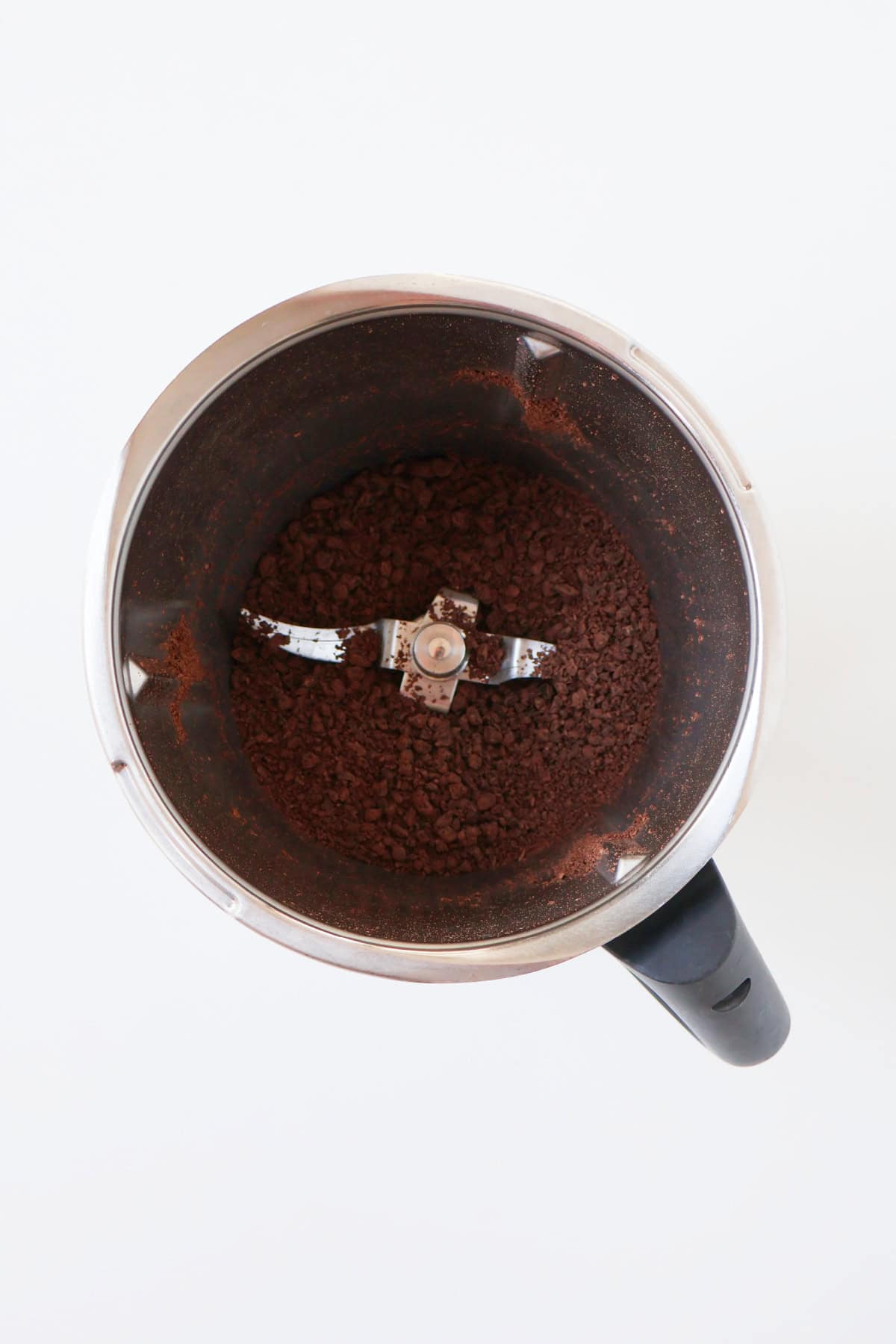 Grated chocolate in a thermomix bowl.