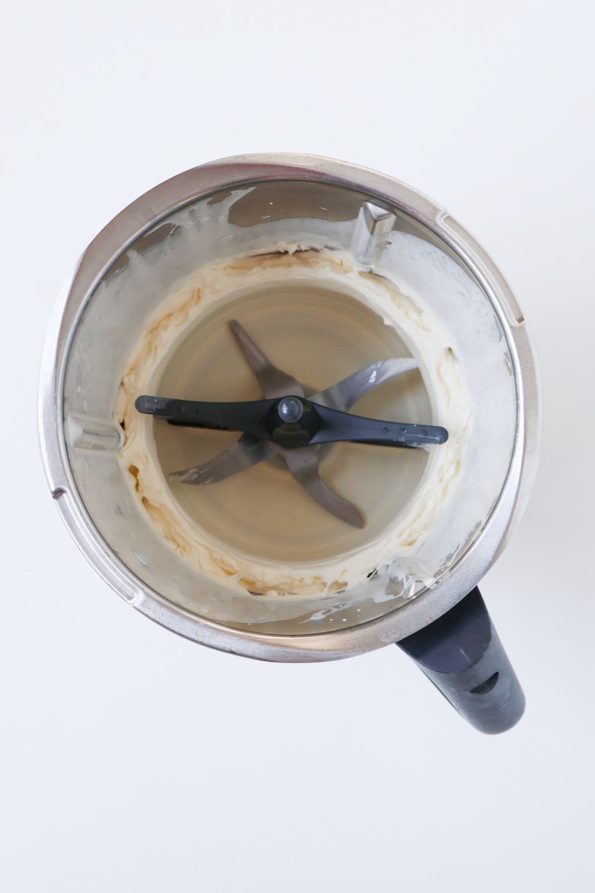 Whipped cream in a thermomix bowl.