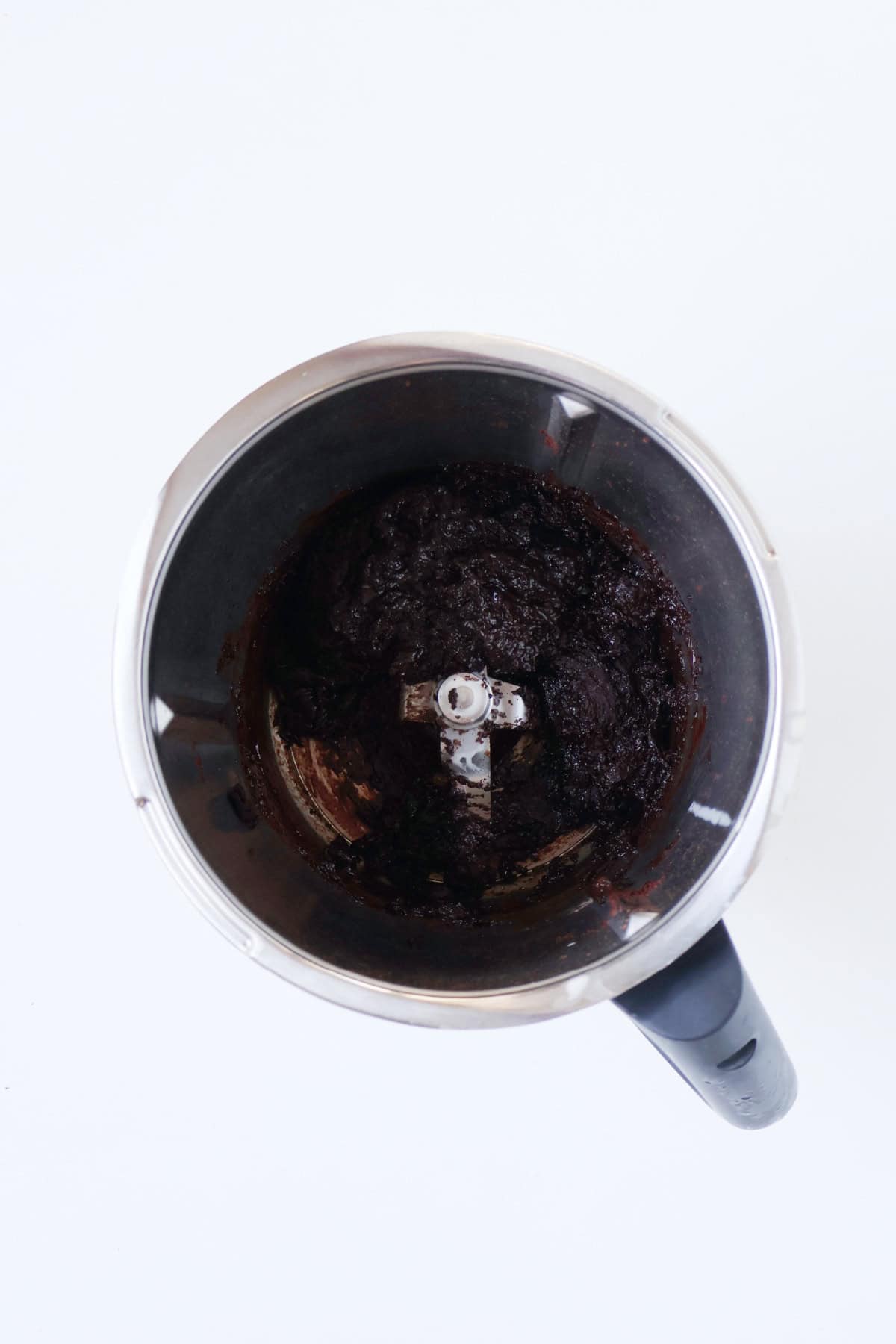 Melted chocolate in a thermomix bowl.