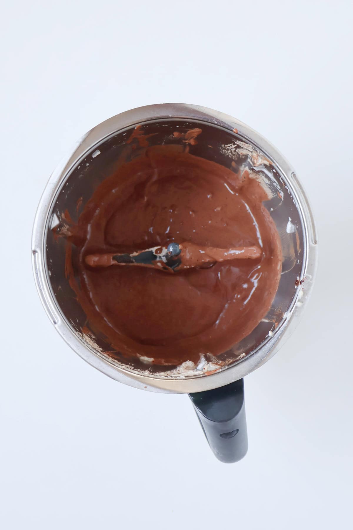 Combined chocolate mousse ingredients in a thermomix bowl.