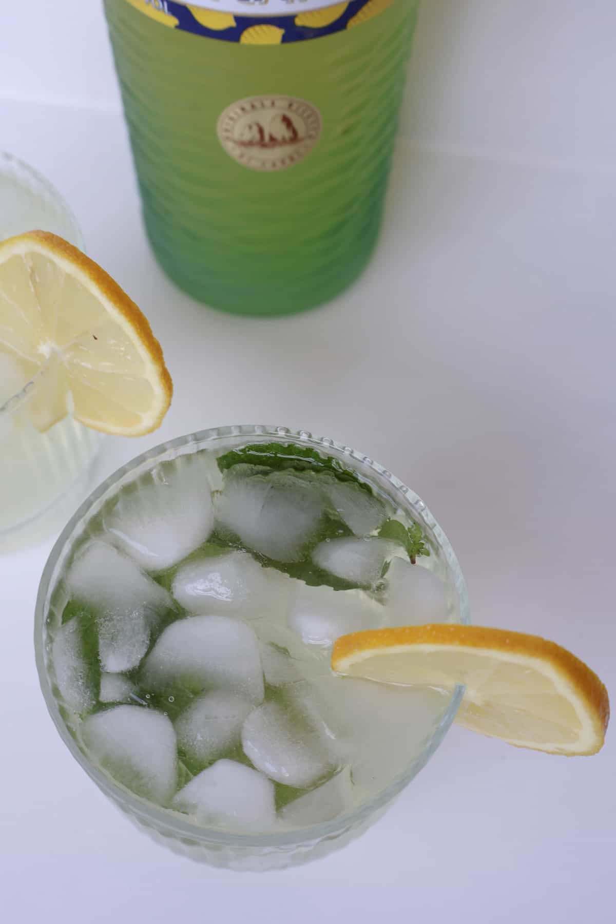 overhead view of Limoncello Spritz garnished with a slice of lemon.