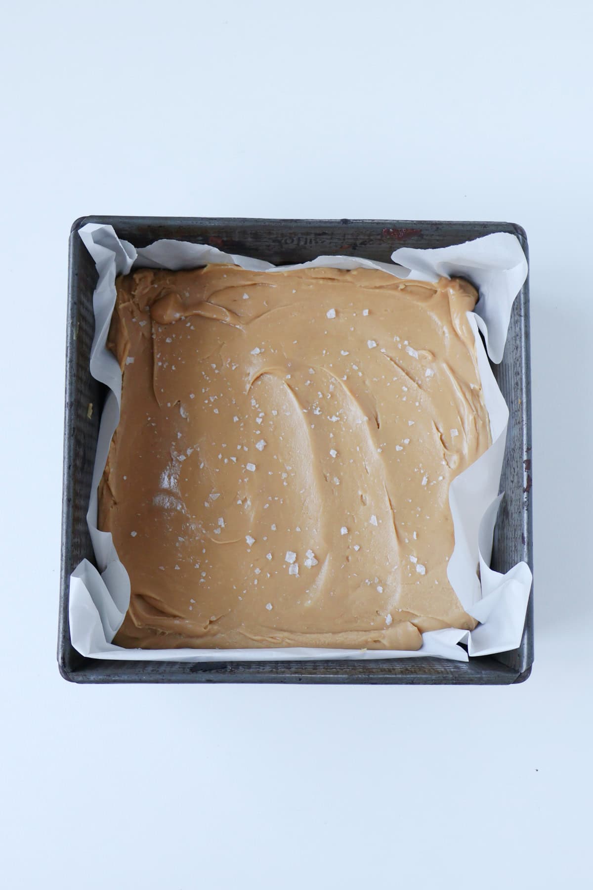 Salted Caramel fudge in a baking dish ready to go into the fridge to set,