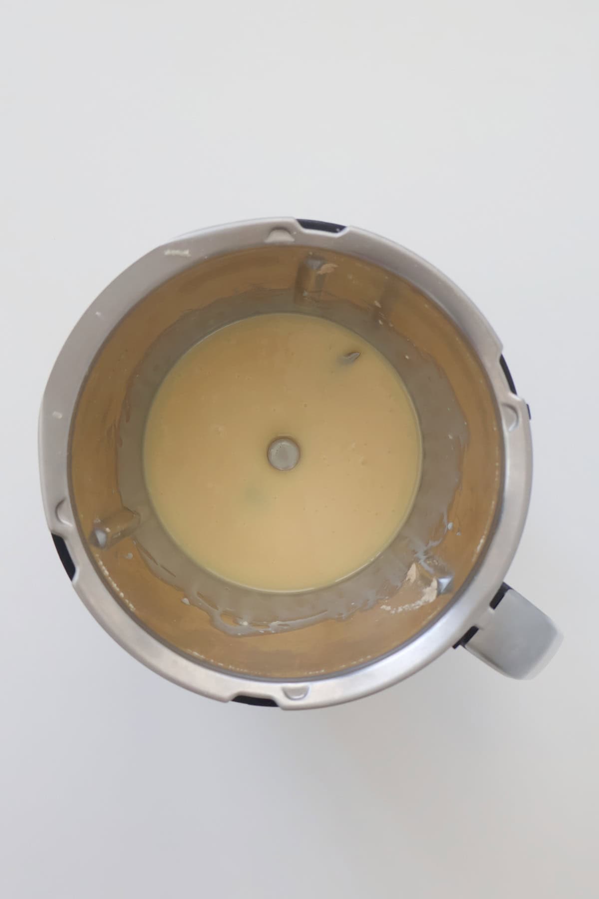 Melted white chocolate and butter in a thermomix bowl.