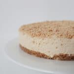 Thermomix Caramilk Cheesecake Caramilk Cheesecake on a white footed serving plate.